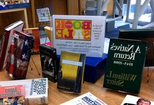 A variety of books displayed on a table for a book sale event at Howard Payne University. | HPU